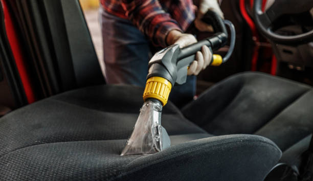 A specialist vacuuming driver's seat.